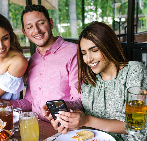 Group of latin friends eating mexican food in the restaurant terrace in Mexico Latin America