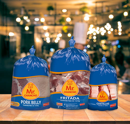 Wood table top with blur chef cooking in bar restaurant background.For create product display or design key visual layout