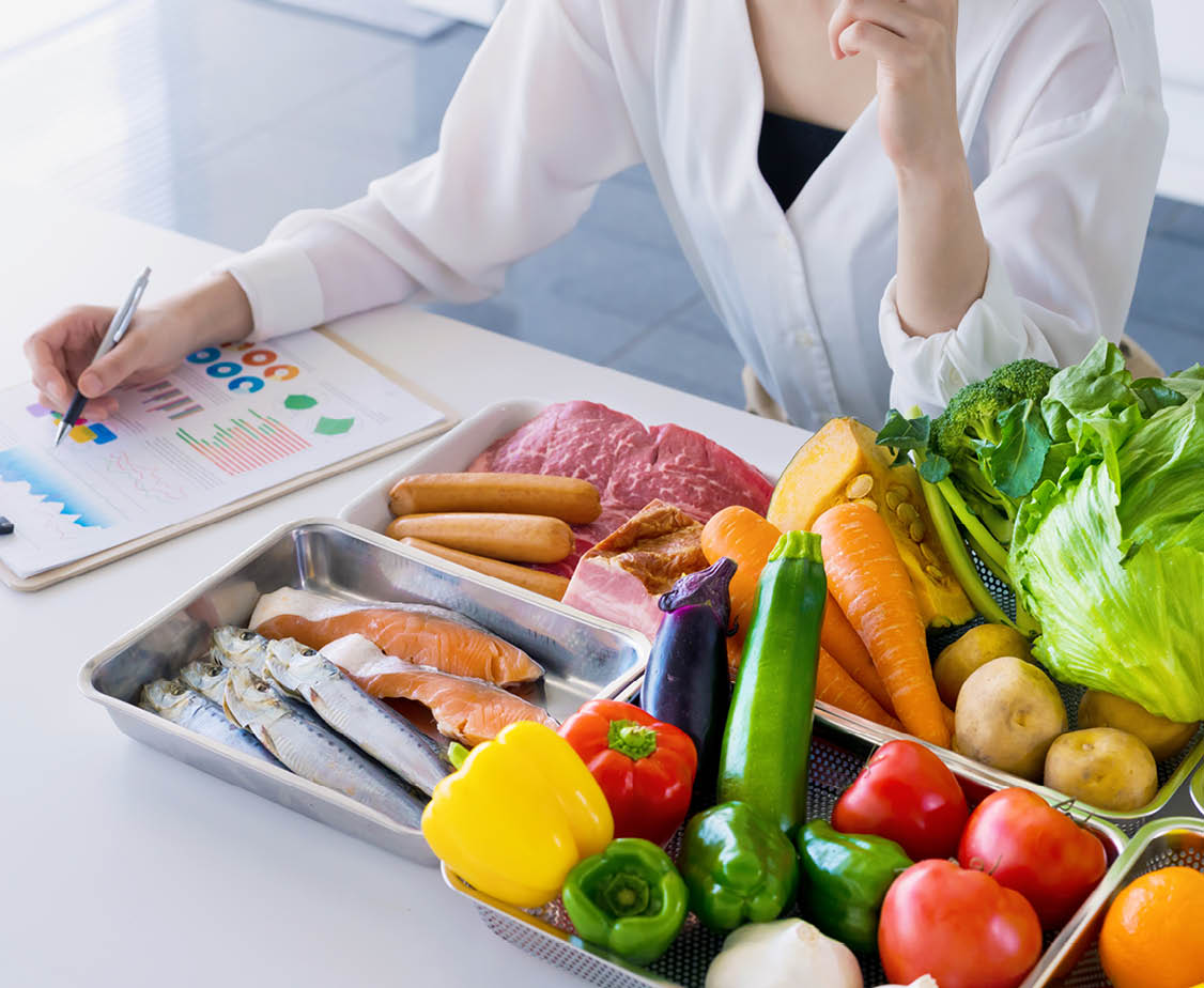 Young woman and foodstuff. Food coordinator. Nutritionist.